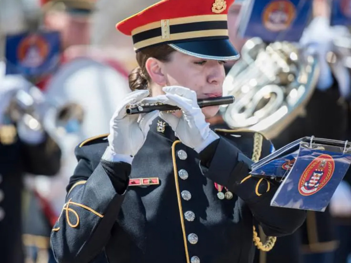 Army Band Soldier in uniform playing a piccolo
