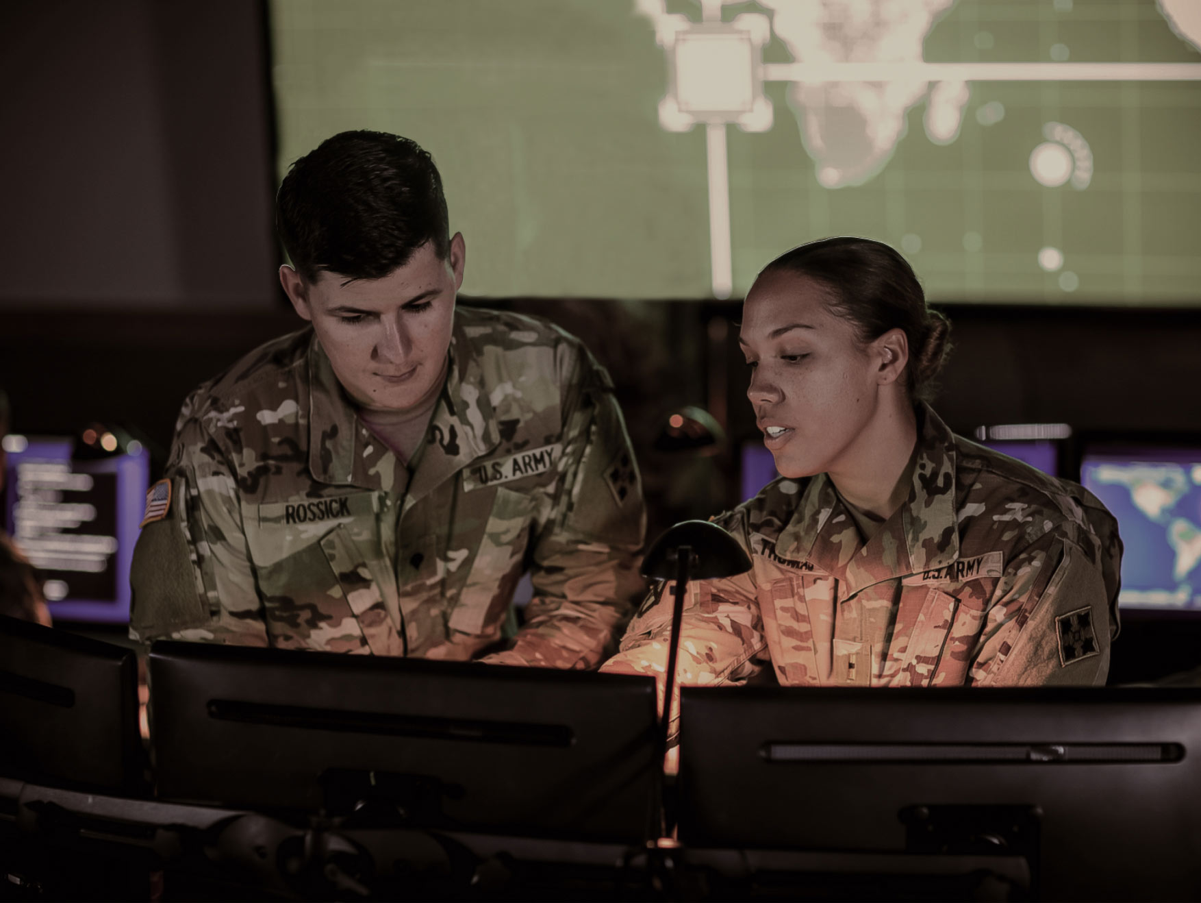 Army Cyber Soldiers in front of computers, working inside a Cyber center.